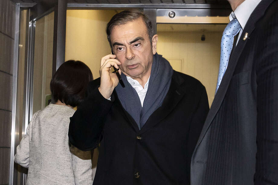 Former Nissan chairman Carlos Ghosn leaves his law firm in Toyko on March 12. Photo: Bloomberg Photo by Keith Bedford / Bloomberg