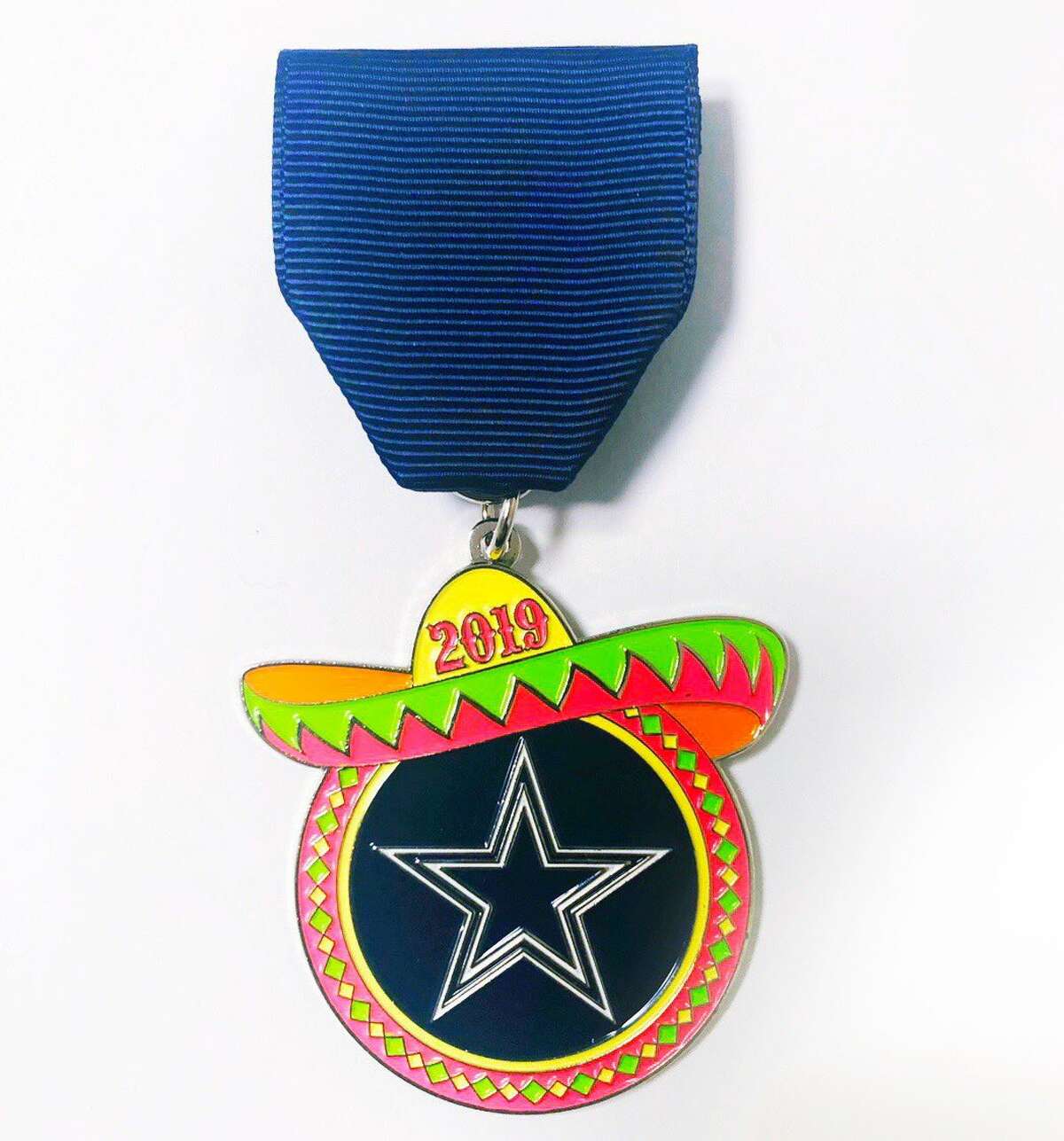 For the first time ever, the Dallas Cowboys will be a part of San Antonio's Fiesta with a team medal. The new medal features the team's logo surrounded by a colorful border and topped by a sombrero, as seen in a reveal photo tweeted by the Fiesta San Antonio Twitter account.