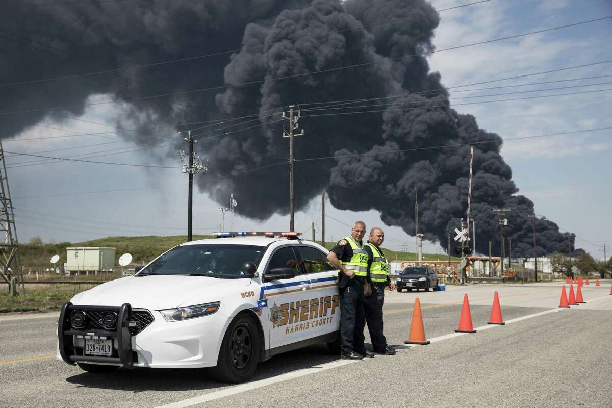 Harris County Sheriff officers control traffic near a fire at the Intercontinental Terminals Co (ITC) petrochemical storage site in City, Texas, U.S., on March 19, 2019. Photographer: Scott Dalton/Bloomberg