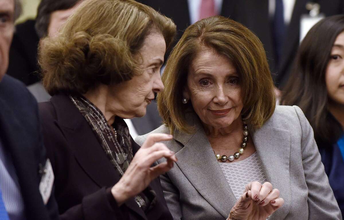 FILE PHOTO: House Speaker Nancy Pelosi (D-Calif.) and Sen. Dianne Feinstein (D-Calif.) attend an event on Capitol Hill Tuesday, March 12, 2019 in Washington, D.C. honoring the memory of Lodi Gyari, retired special envoy of His Holiness the Dalai Lama, senior official of the Central Tibetan Administration, and executive chairman of the International Campaign for Tibet (ICT), who died Oct. 29, 2018. Feinstein commented Wednesday on Pelosi's decision to withhold the articles of impeachment.