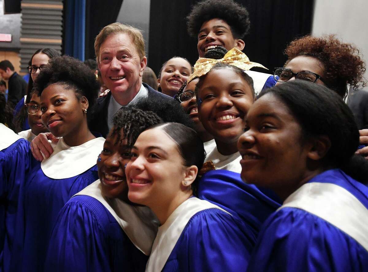 Governor Ned Lamont poses for a photo with the Harding High School Choir during a visit to the school in Bridgeport, Conn. on Tuesday, March 26, 2019.