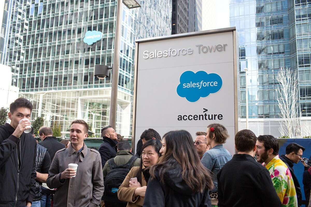 Salesforce employees wait outside of their office building to enter the plaza for a concert on the occasion of celebration of Salesforce's 20th anniversary. On Friday, March 8, 2019. San Francisco, Calif.