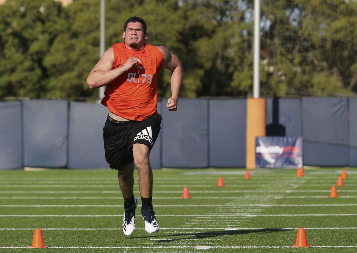 Former UTSA football player David Anzaldua sprints for the finish line in the 40-yard run as part of drills and physical tests under the guise of pro football scouts as UTSA holds its Pro Day on campus on Tuesday, Mar. 26, 2019. 13 players including linebacker Josiah Tauaefa participated in hopes of landing a spot on an pro football team. (Kin Man Hui/San Antonio Express-News)