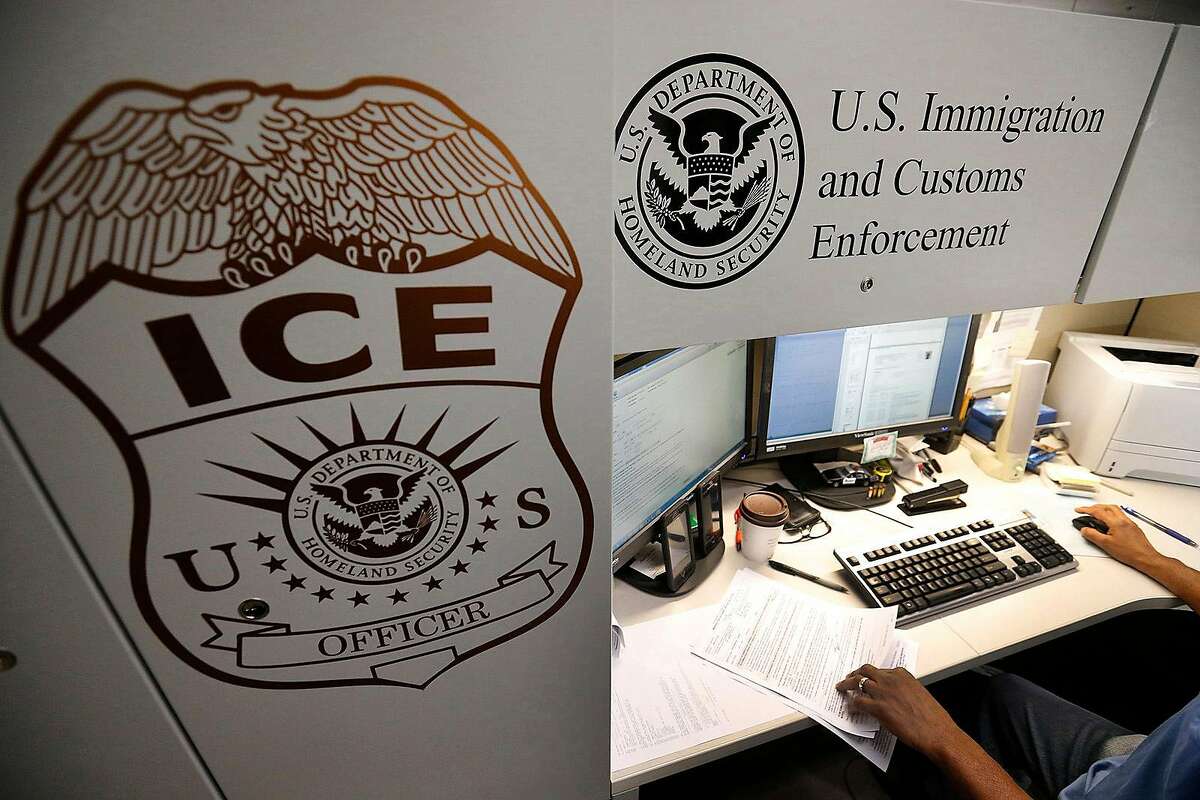 This file photo shows an unidentified Immigration and Customs Enforcement deportation officer reviewing forms on April 26, 2017, at the the Pacific Enforcement Response Center in Laguna Niguel.