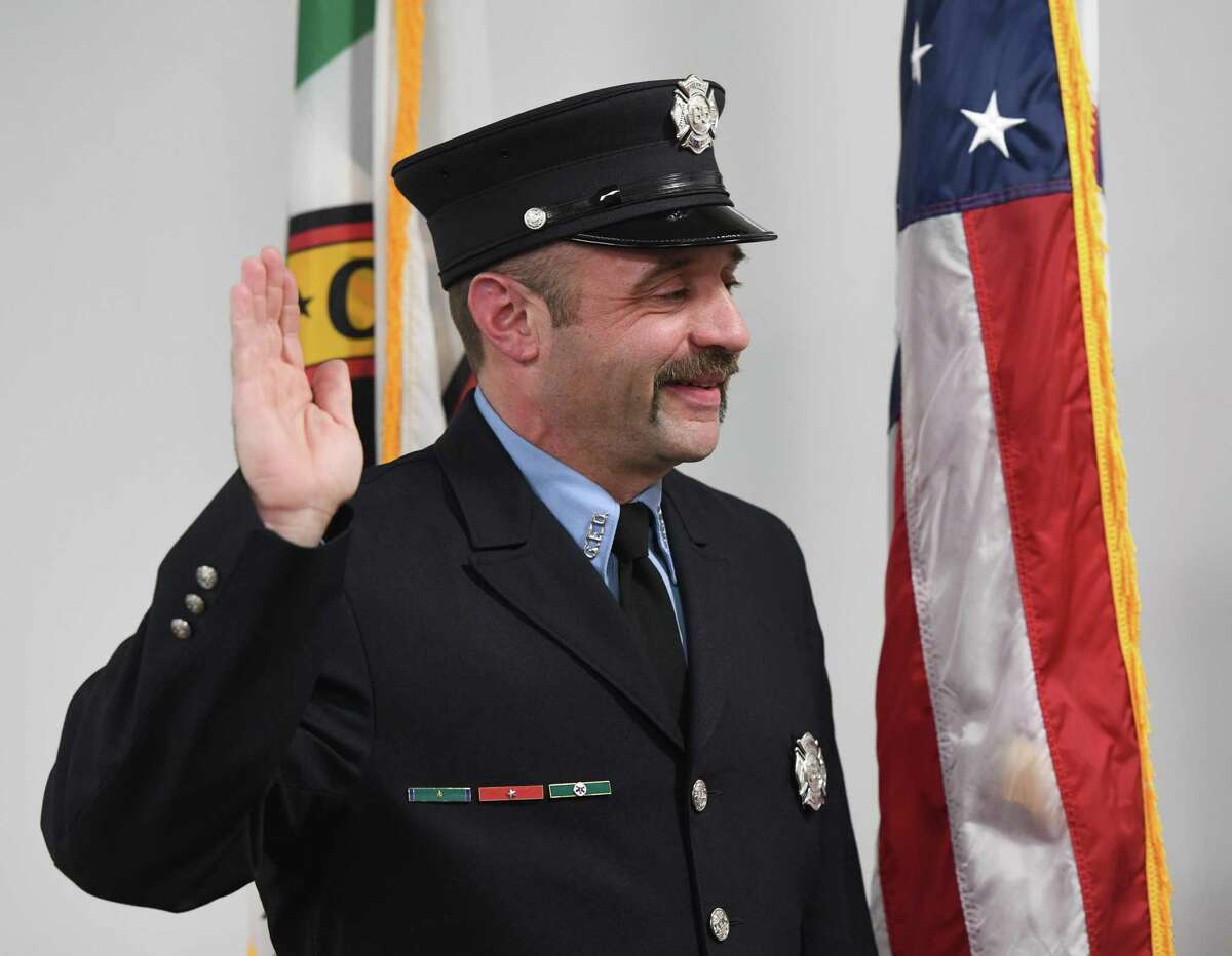 Greenwich Firefighter Bob Roth is sworn in to his new position as Fire Inspector during his promotion ceremony at the Public Safety Complex in Greenwich, Conn. Wednesday, March 27, 2019. Under the promotion, Roth will assume the duties of recently retired Greenwich Deputy Fire Marshal Rich Funck.
