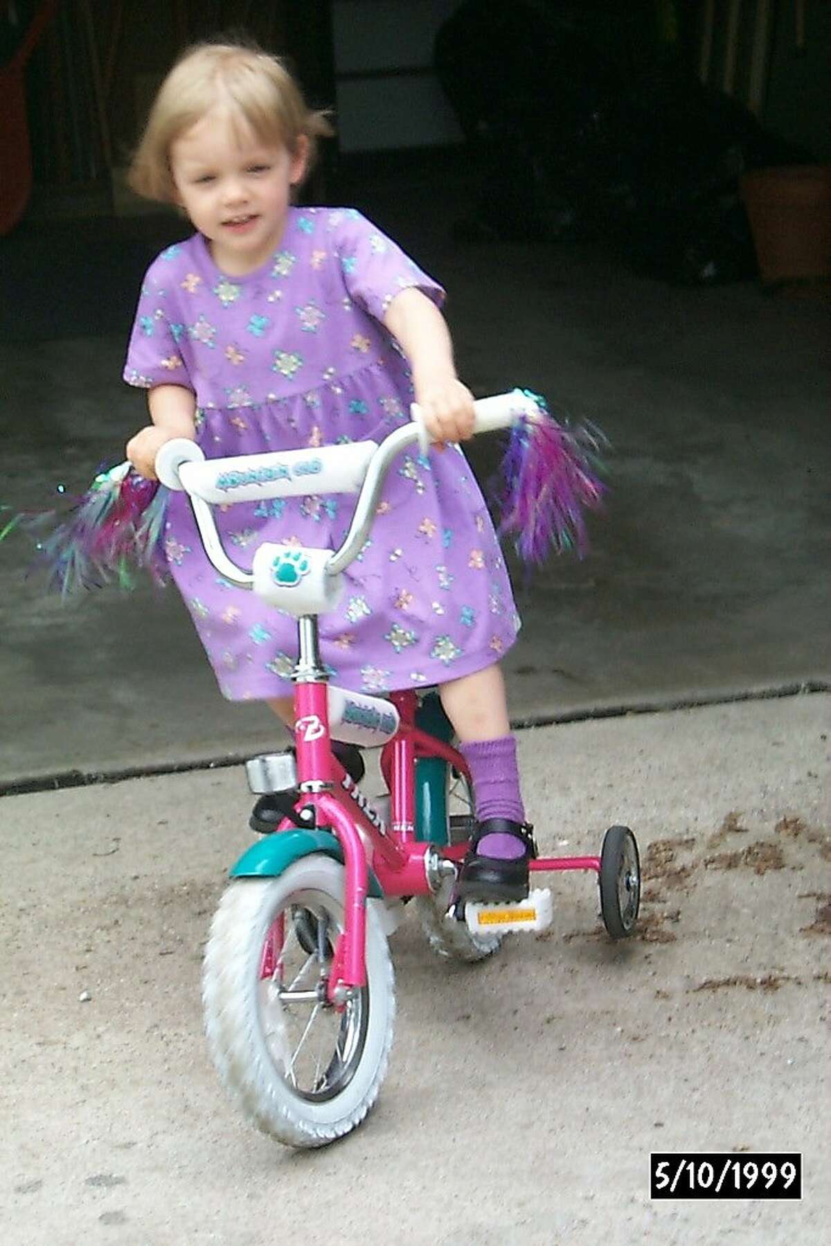Kelly Catlin on a tricycle at age 3.