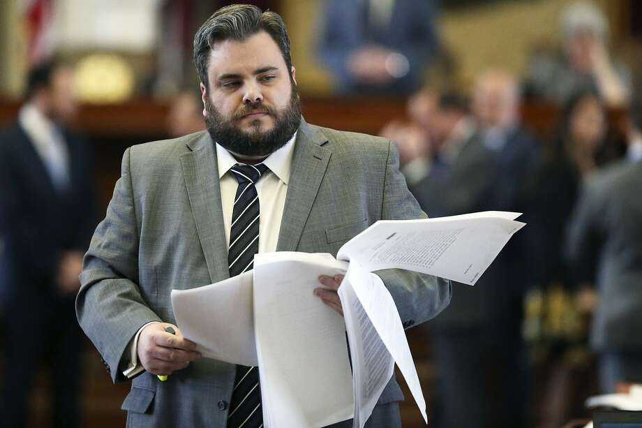 Representative Jonathan Stickland, R-Bedford, gives the floor with pages of legislative documents while the Texas House of Representatives reviews the budget bill on March 27, 2019. Photo: Tom Reel, professional photographer