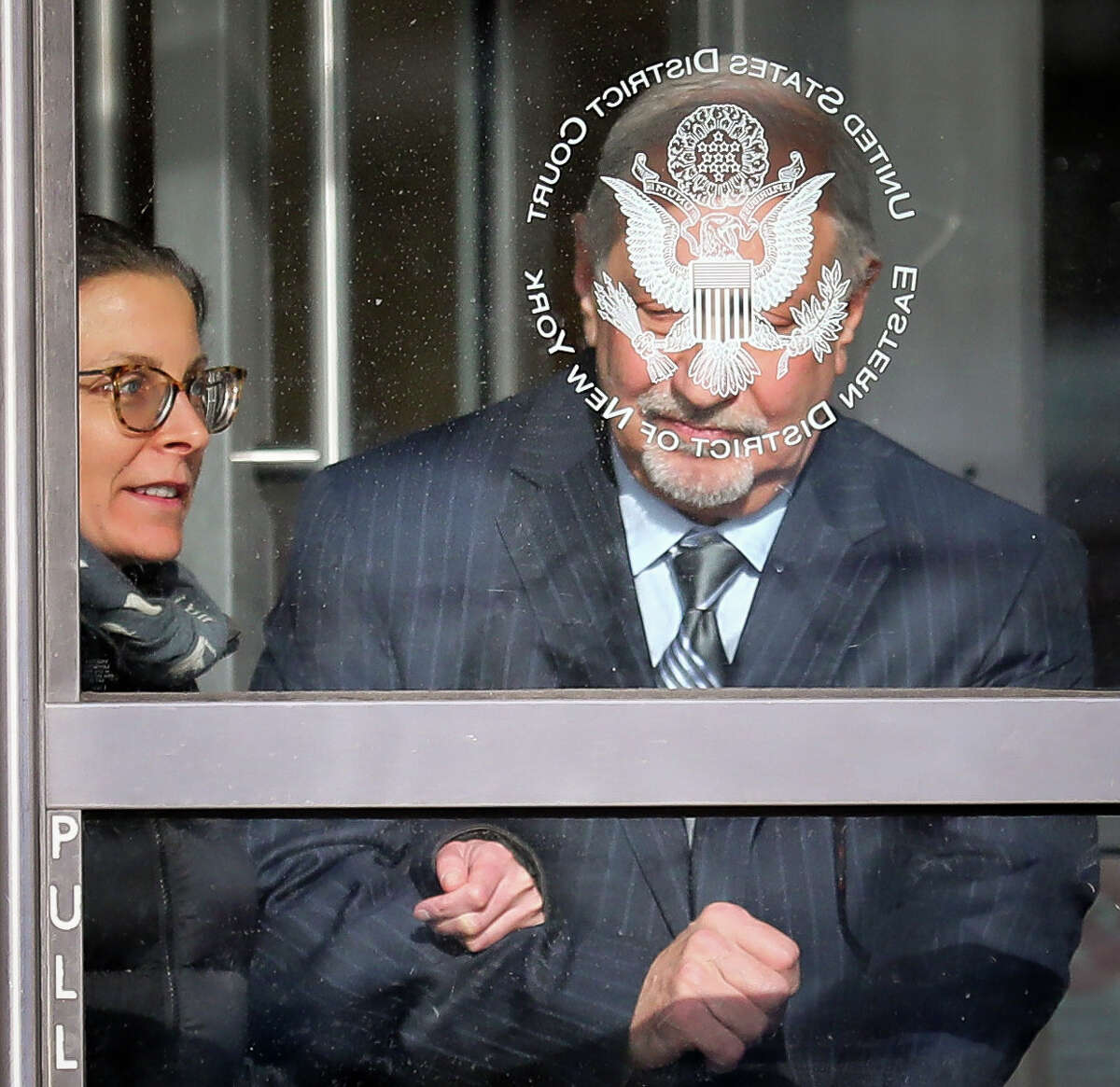 Clare Bronfman, left, a member of Nxivm, an organization charged with sex trafficking, leaves Brooklyn Federal Court with her lawyer Mark Geragos after she received medical attention while in court, Wednesday March 27, 2019, in New York.