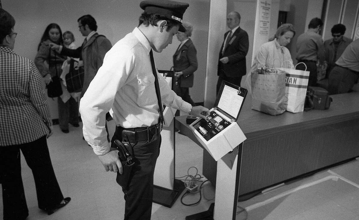 Jan. 5, 1973: Guards check passengers using state-of-the-art equipment at the first security lines at San Francisco International Airport.