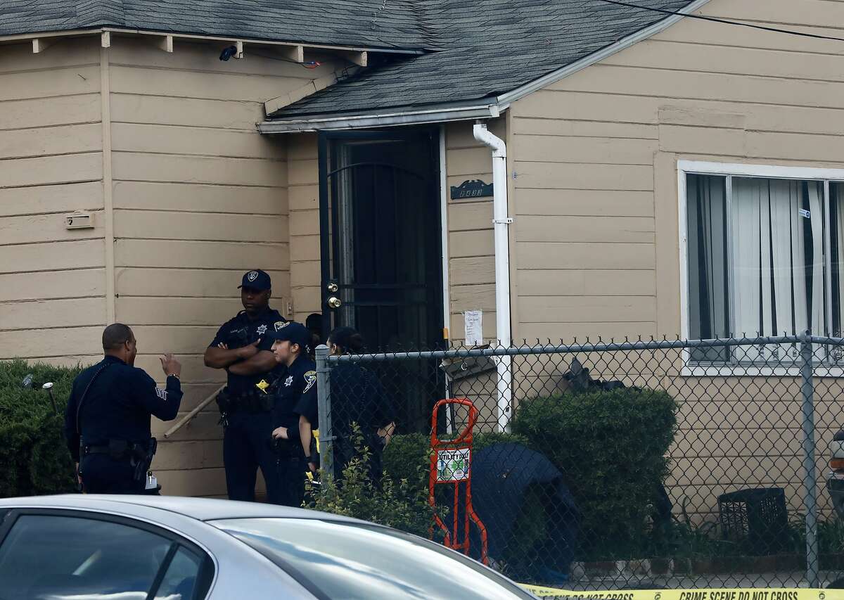 Oakland police officers stand outside 2433 Ritchie St. following the shooting of a four-year-old male that occurred hours earlier in Oakland, Calif., on Wednesday, March 27, 2019.