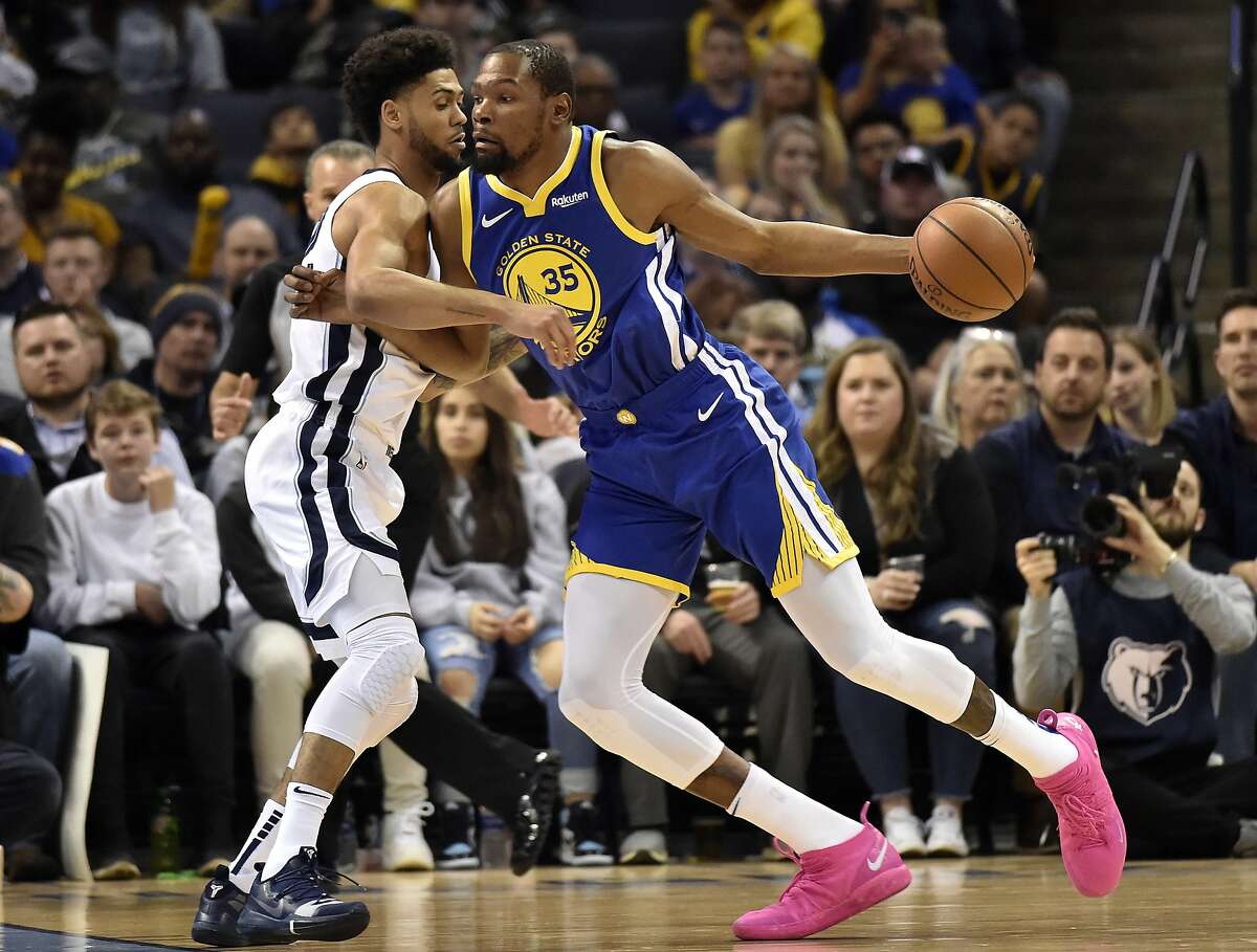 Golden State Warriors forward Kevin Durant (35) is defended by Memphis Grizzlies guard Tyler Dorsey during the first half of an NBA basketball game Wednesday, March 27, 2019, in Memphis, Tenn. (AP Photo/Brandon Dill)