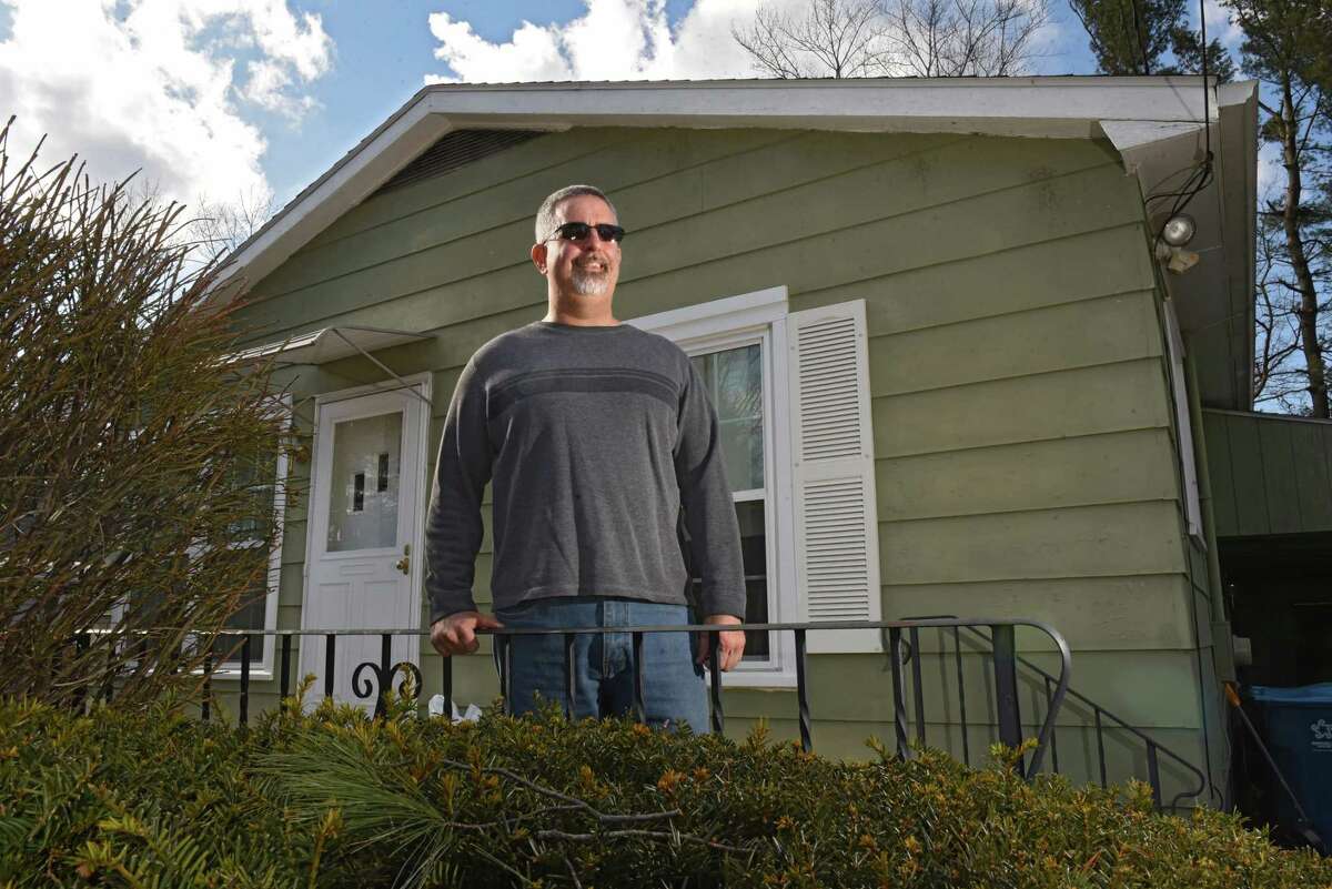 William Day stands in front of his home on Tuesday, March 19, 2019 in Colonie, N.Y. Day used a benefit in his GI Bill to get a home loan. (Lori Van Buren/Times Union)