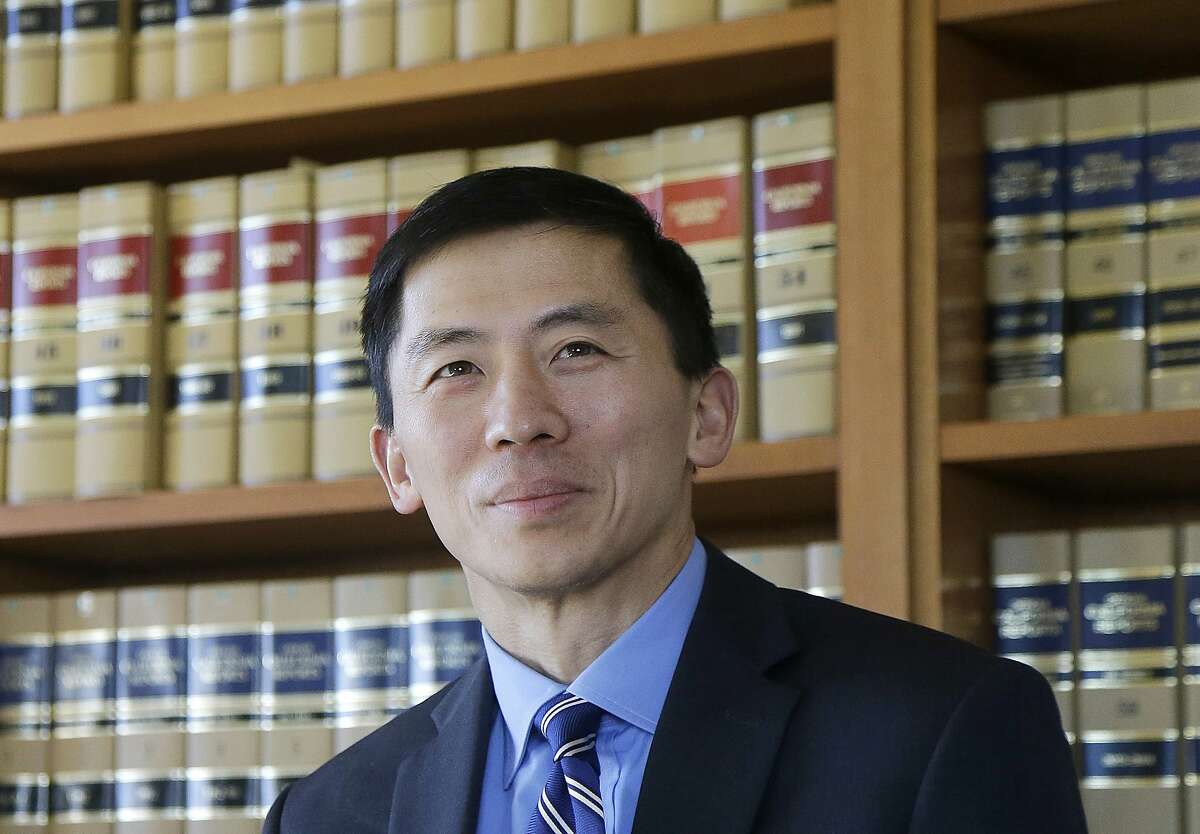 FILE - In this Jan. 13, 2017 file photo California Supreme Court Associate Justice Goodwin Liu pauses in his office in San Francisco. The California Supreme Court justice says the death penalty system in the most populous state is dysfunctional, expensive and doesn't deliver justice in a timely way. Liu made the comments in an unusual opinion issued Thursday, March 28, 2019, after the full court unanimously upheld Thomas Potts' death sentence. Potts was convicted in a 1997 killing of an elderly couple. (AP Photo/Jeff Chiu, File)