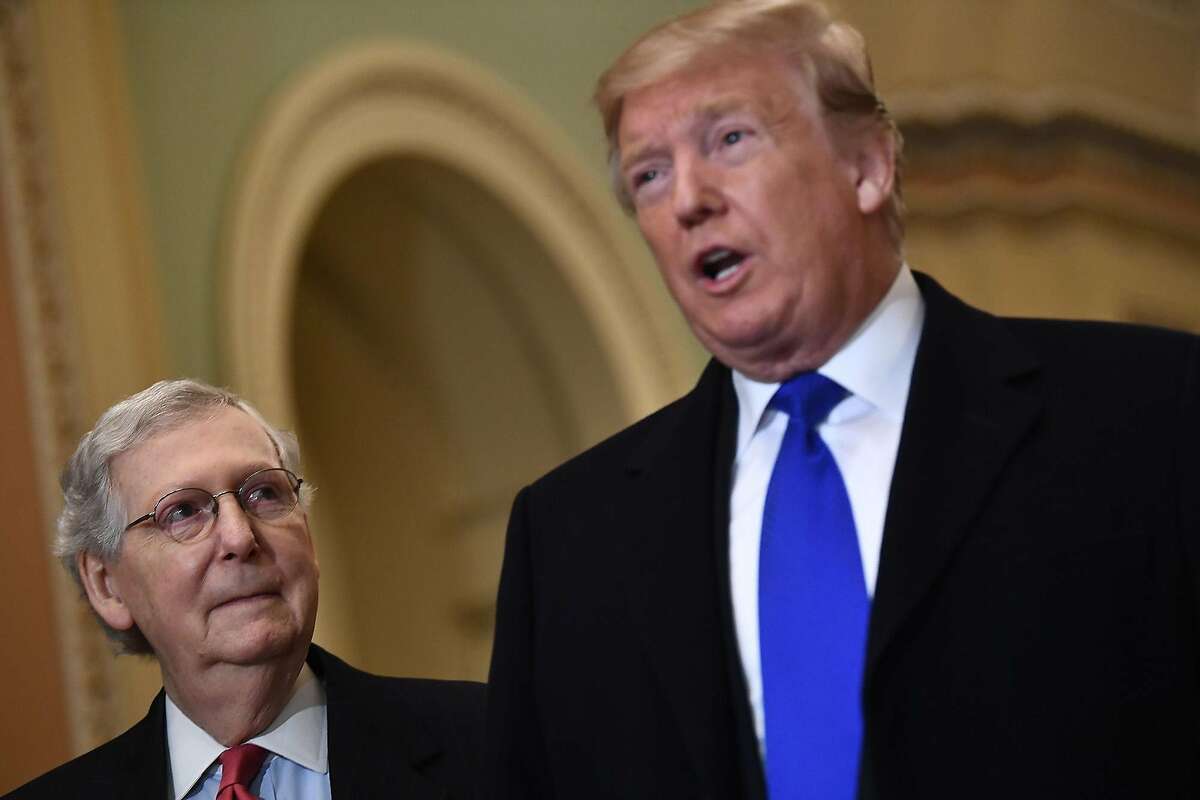 U.S. President Donald Trump, right, speaks to the press alongside Senate Majority Leader Mitch McConnell as he arrives on Capitol Hill on Tuesday, March 26, 2019 before joining Senate Republicans for lunch in Washington, D.C. (Brendan Smialowski/AFP/Getty Images/TNS)