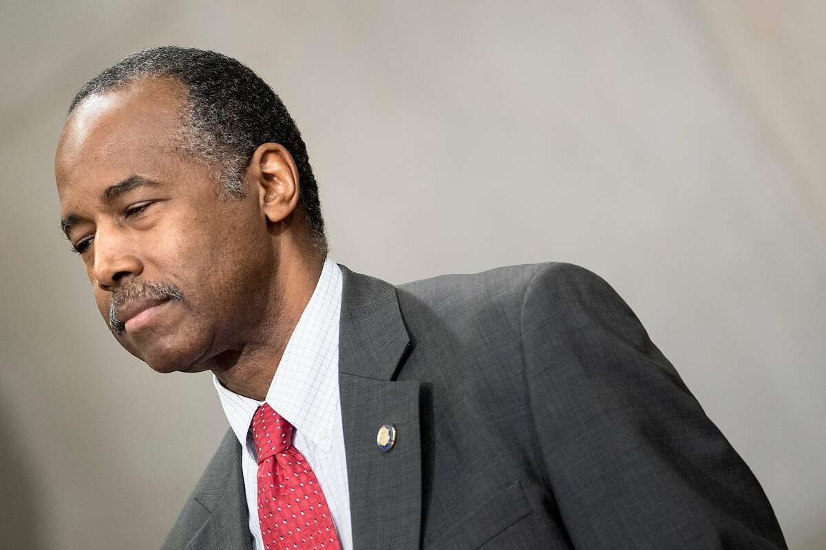 FILE - In this file photo taken on April 12, 2018 US Secretary of Housing and Urban Development Ben Carson waits to speak during an event to honor the 50th anniversary of the Fair Housing Act at the Department of Justice in Washington, DC. - US officials accused Facebook of discrimination March 28, 2019 for using its targeted advertising to limit who sees postings for certain kinds of housing.