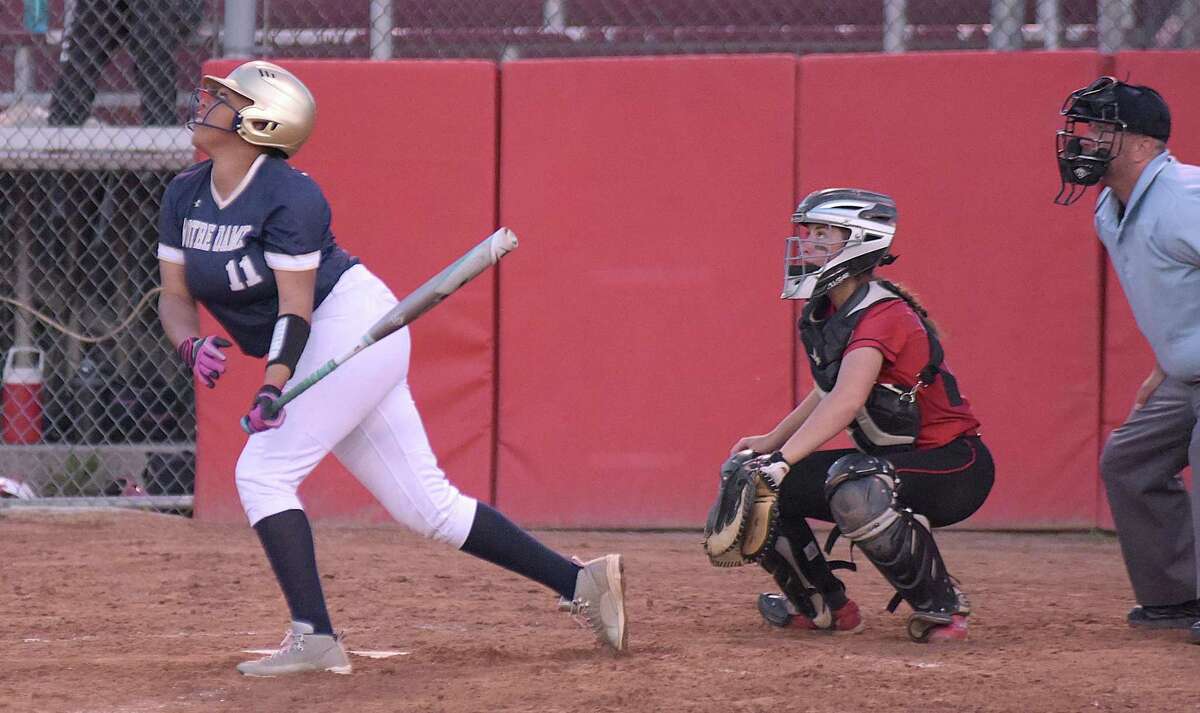 Notre Dame-Fairfield's Breana Brown, left, watches a ball get put into play along with Masuk catcher Katie Pullen during Thursday's SWC semifinal at DeLuca Field in Stratford.