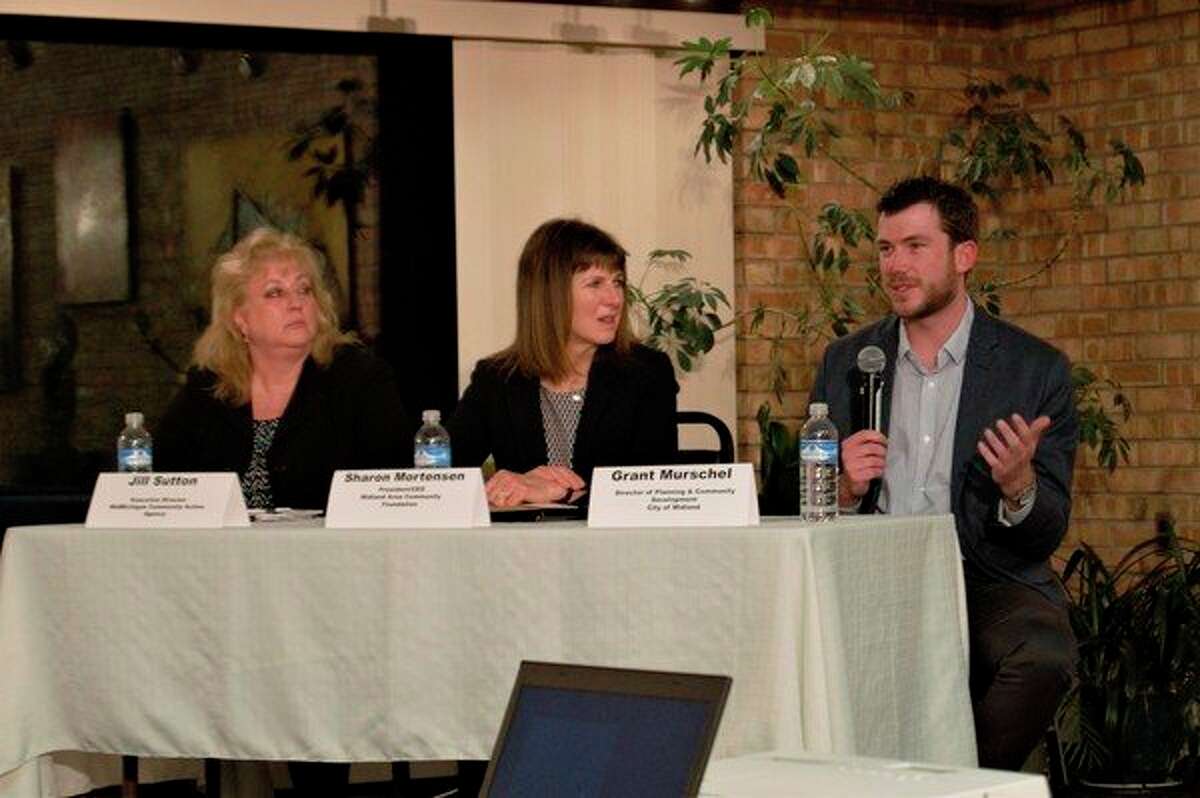 Jill Sutton, Sharon Mortensen and Grant Murschel speak at a panel discussion about housing, hosted by the League of Women Voters of the Midland Area, on March 28 at Creative 360 in Midland. (Ashley Schafer/ashley.schafer@hearstnp.com)