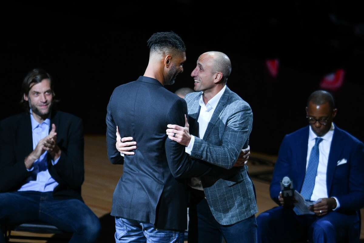 Manu Ginoboli is congratulated by former teammate Tim Duncan during Ginobili's retirement ceremony.