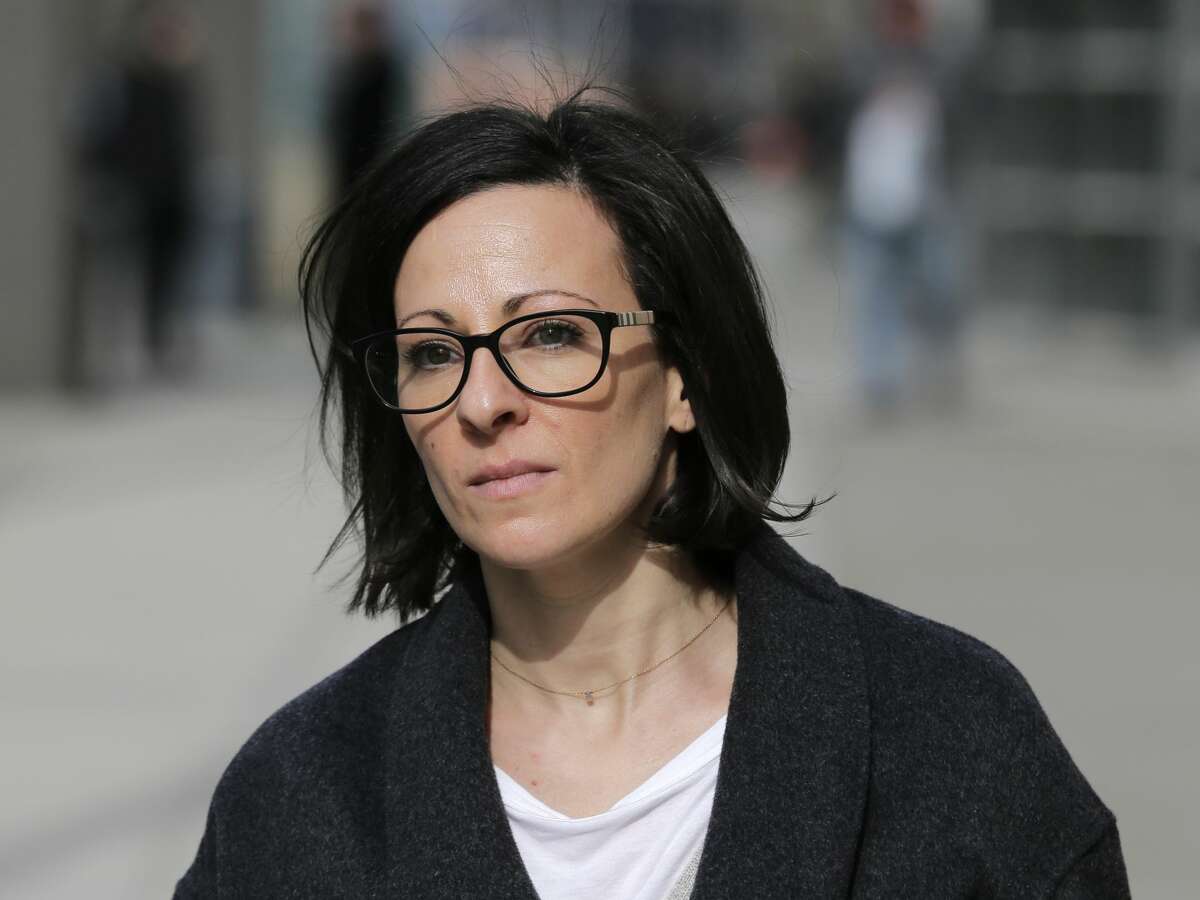 Lauren Salzman leaves Brooklyn federal court in New York, Monday, Jan. 28, 2019. When she pleaded guilty on March 25, Salzman admitted that she had recruited women into a secret slave-master club founded by Raniere and had threatened to release damaging information about those women if they did not perform tasks or tried to leave the group. (Associated Press / Seth Wenig)