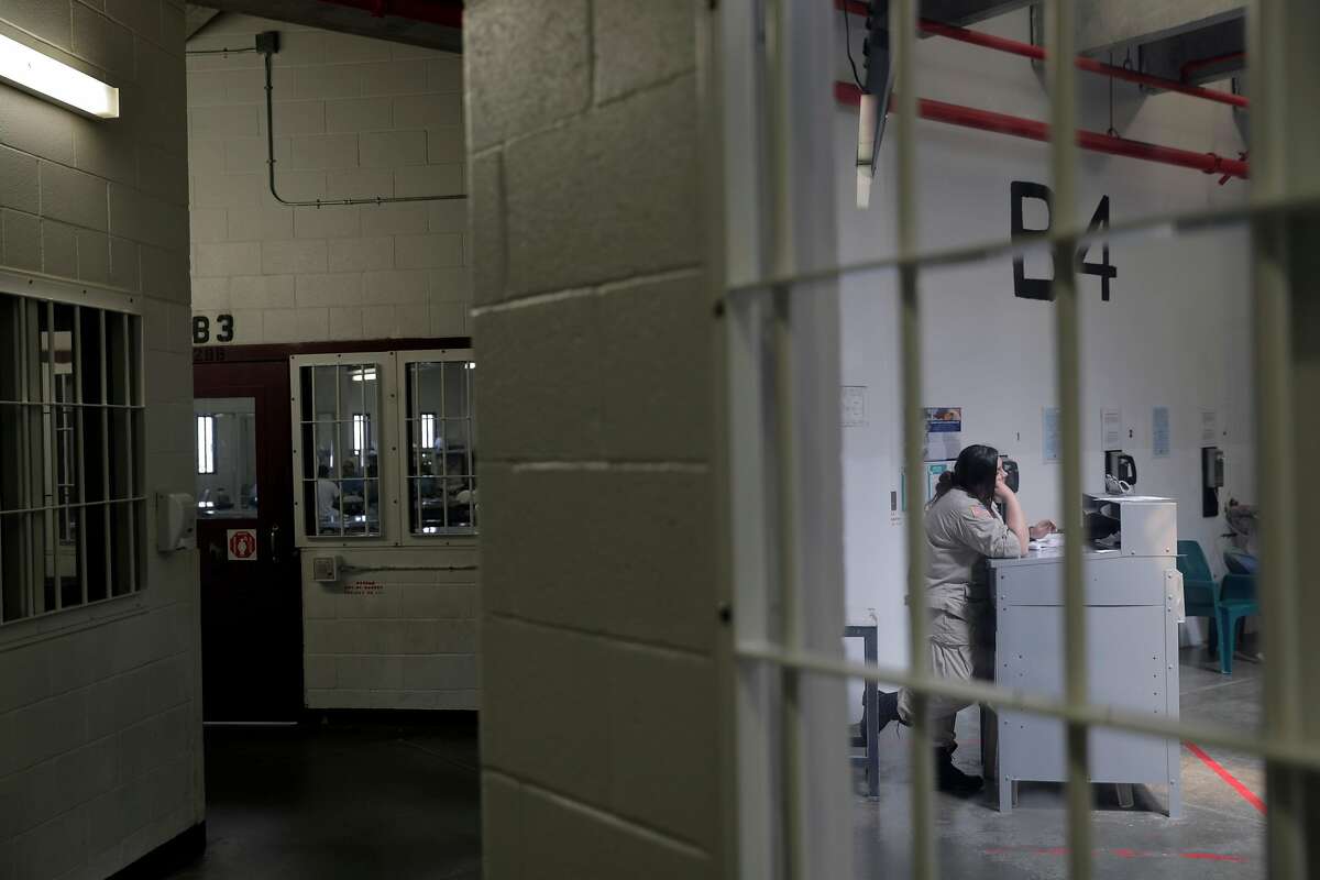 Corrections Officer Casta�eda keeps an eye on inmates in dormitory B4 at the Central Valley Modified Modified Community Correctional Facility in McFarland, Calif., on Thursday, March 28, 2019. California Gov. Gavin Newsom is trying to figure out how to empty privately run prisons of California inmates, who would be sent to state-run lockups like this one run by GEO Group.