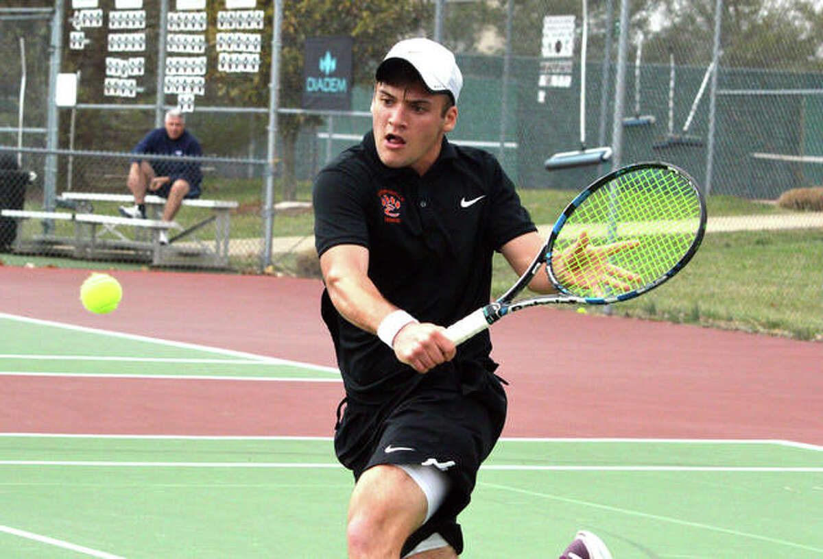 Edwardsville senior Seth Lipe reaches for a backhand during his No. 2 singles match against Riverfield High School from Tulsa, Okla., on Friday at the EHS Tennis Center.