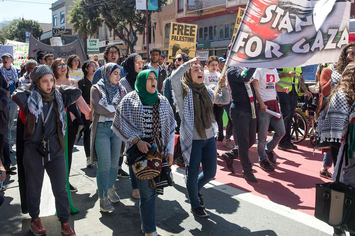 People take part in a rally which marks the first anniversary of the Great March of Return in Gaza to end Israel's blockade of Gaza. On Saturday, March 30, 2019. San Francisco, Calif.