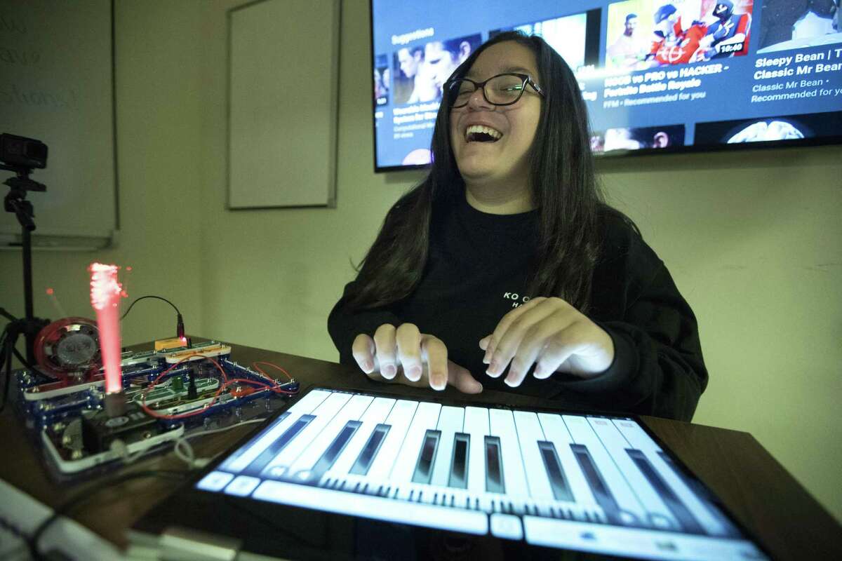 Rachel Coronado, 13, lights up a panel while playing a keyboard after completing a circuit while participating in the University of Houston’s Chevron Girls Engineering the Future STEM Day on Saturday, March 30, 2019, in Houston. Girls, in grades four through eight, participated in hands-on activities organized by faculty and student organizations from the University’s Cullen College of Engineering, College of Natural Sciences and Mathematics and College of Technology.