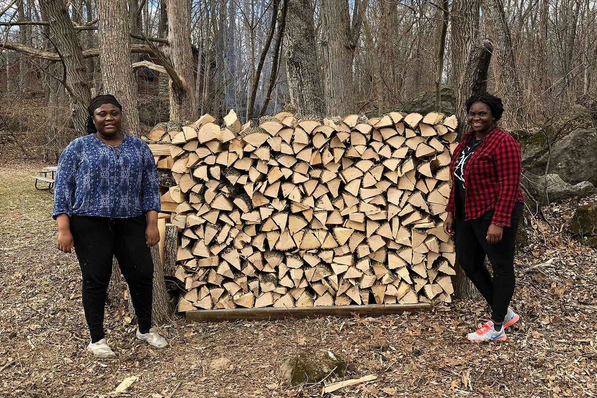 Wesleyan University students chopped and stacked wood at the faith-based Johnsonburg Camp & Retreat Center.