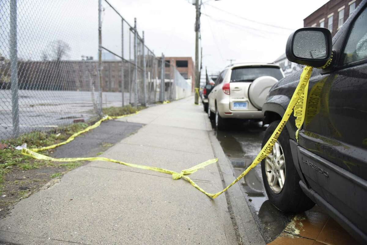 Police tape marks the scene of a fatal shooting on Garden Street in the South End of Stamford, Conn. Sunday, March 31, 2019. A man in his mid-20s was shot multiple times and killed late Saturday night. The shooting is city's first homicide of 2019 and nobody has yet been arrested in connection with the crime.