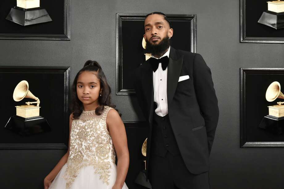 FILE – Emani Asghedom and Nipsey Hussle attend the 61st Annual Grammy Awards at Staples Center in this February 10, 2019 file photo in Los Angeles. According to the Los Angeles Police Department, Hussle was shot in front of his Los Angeles store on Sunday, March 31, and has died at age 33, according to multiple reports. Photo: David Crotty/Patrick McMullan Via Getty Image