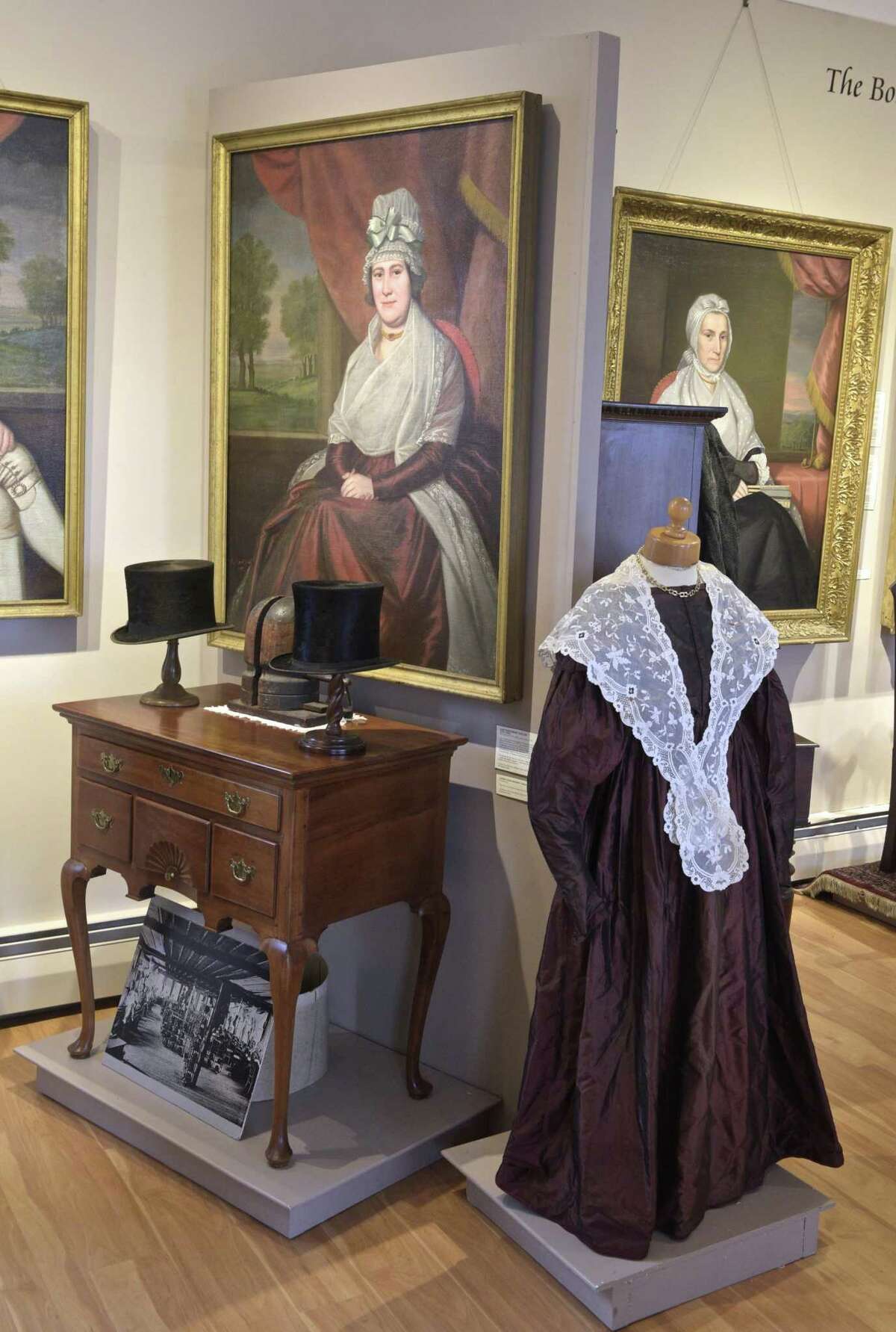 A burgundy red silk dress worn by Ann Northrop Taylor (1751-1810) on display and in a portrait displayed at the New Milford Historical Society in the society's newest exhibit. On display are select clothes and accessories from their permanent collection. Friday, March 22, 2019, in New Milford, Conn.