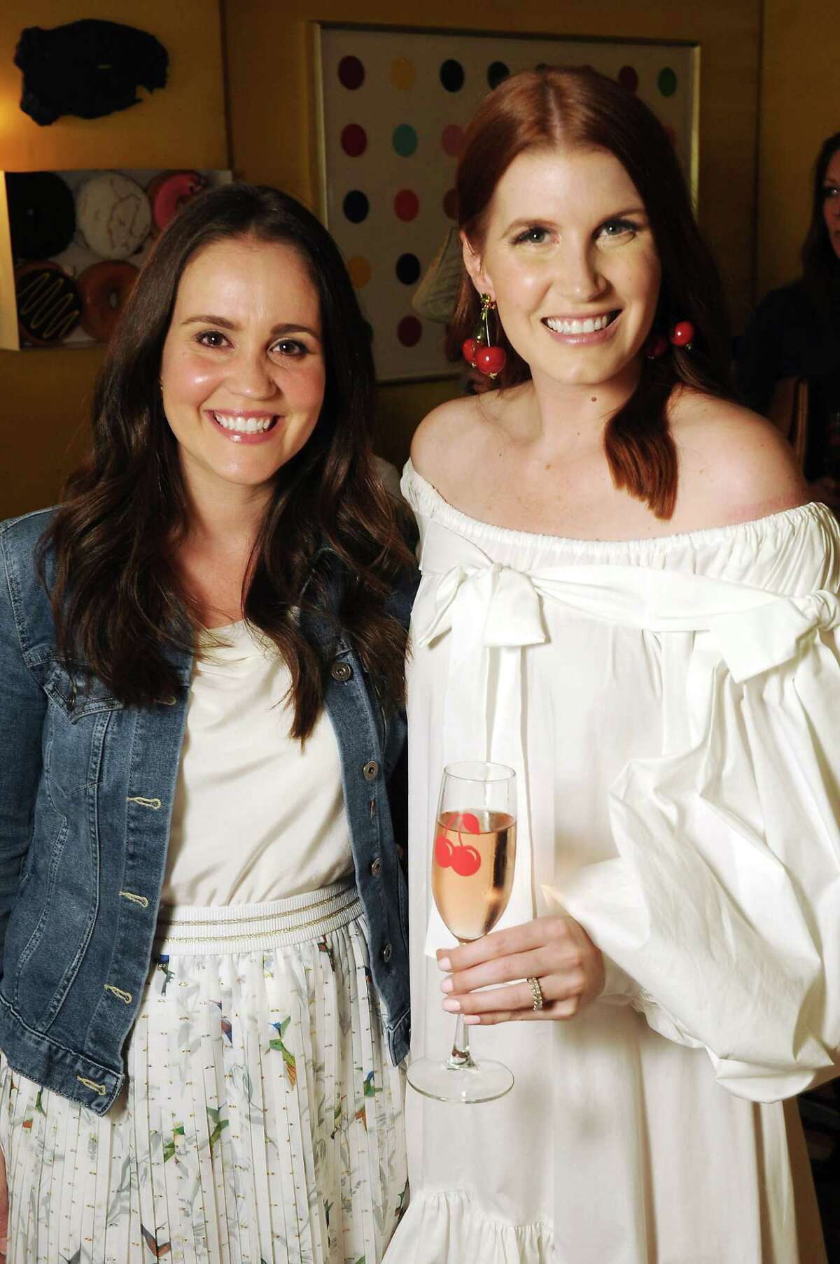 Marie Flanagan and Amber Venz Box at a launch party for the Cherry App at the home of Bailey McCarthy Friday March 29,2019. (Dave Rossman Photo)