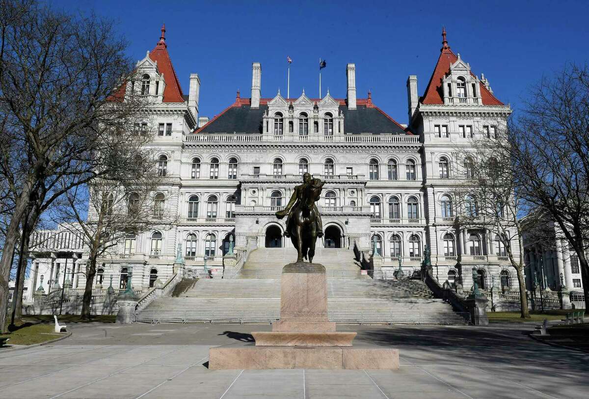 This photo shows an exterior view of the New York state Capitol Monday, April 1, 2019, in Albany, N.Y. A statewide ban on plastic bags and first-in-the-nation tolls for motorists entering the busiest sections of Manhattan are coming to New York under a new state budget that takes several ambitious steps to address long-standing environmental and transportation challenges.