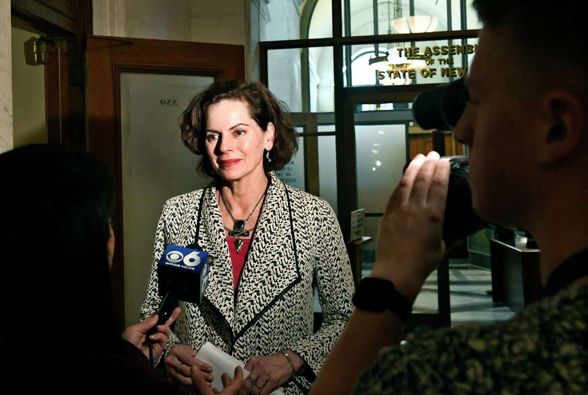 Assemblywoman Patricia Fahy, D-Albany, talks with reporters outside the Assembly Chamber after legislators completed the state budget in the early morning hours at the state Capitol Monday, April 1, 2019, in Albany, N.Y.
