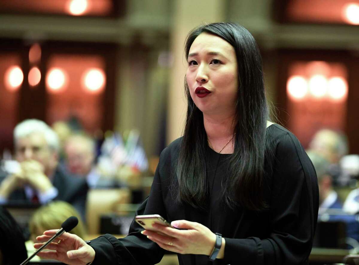 Assemblywoman Yuh-Line Niou, D-New York, speaks as members of the Assembly debate budget bills in the Assembly Chamber at the state Capitol, Sunday, March, 31, 2019, in Albany, N.Y.