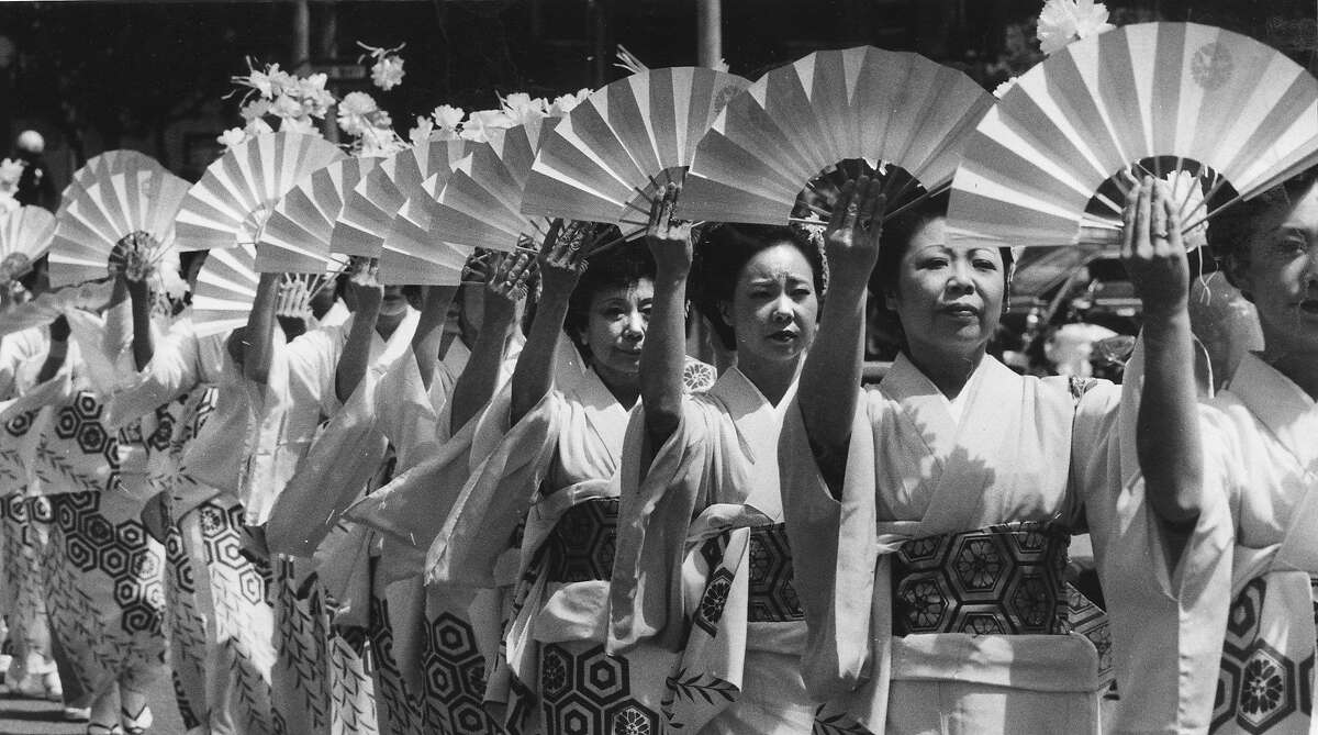 Oshin Dancers with fans at the Cherry Blossom Festival parade, April 29, 1984 Photo ran 04/30/1984, p. 3
