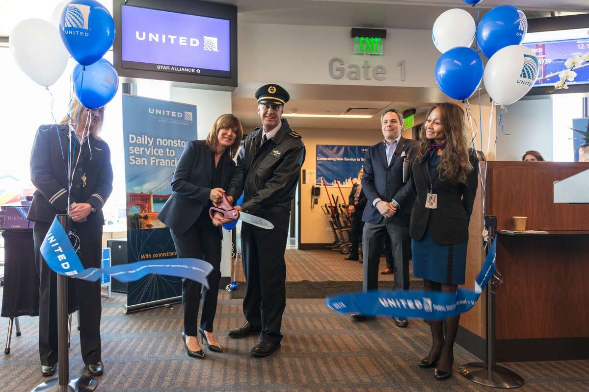 United Airlines cuts the ceremonial ribbon to kick off their flights from Everett's Paine Field. (Photo by Francis Zera/zeraphoto.com)