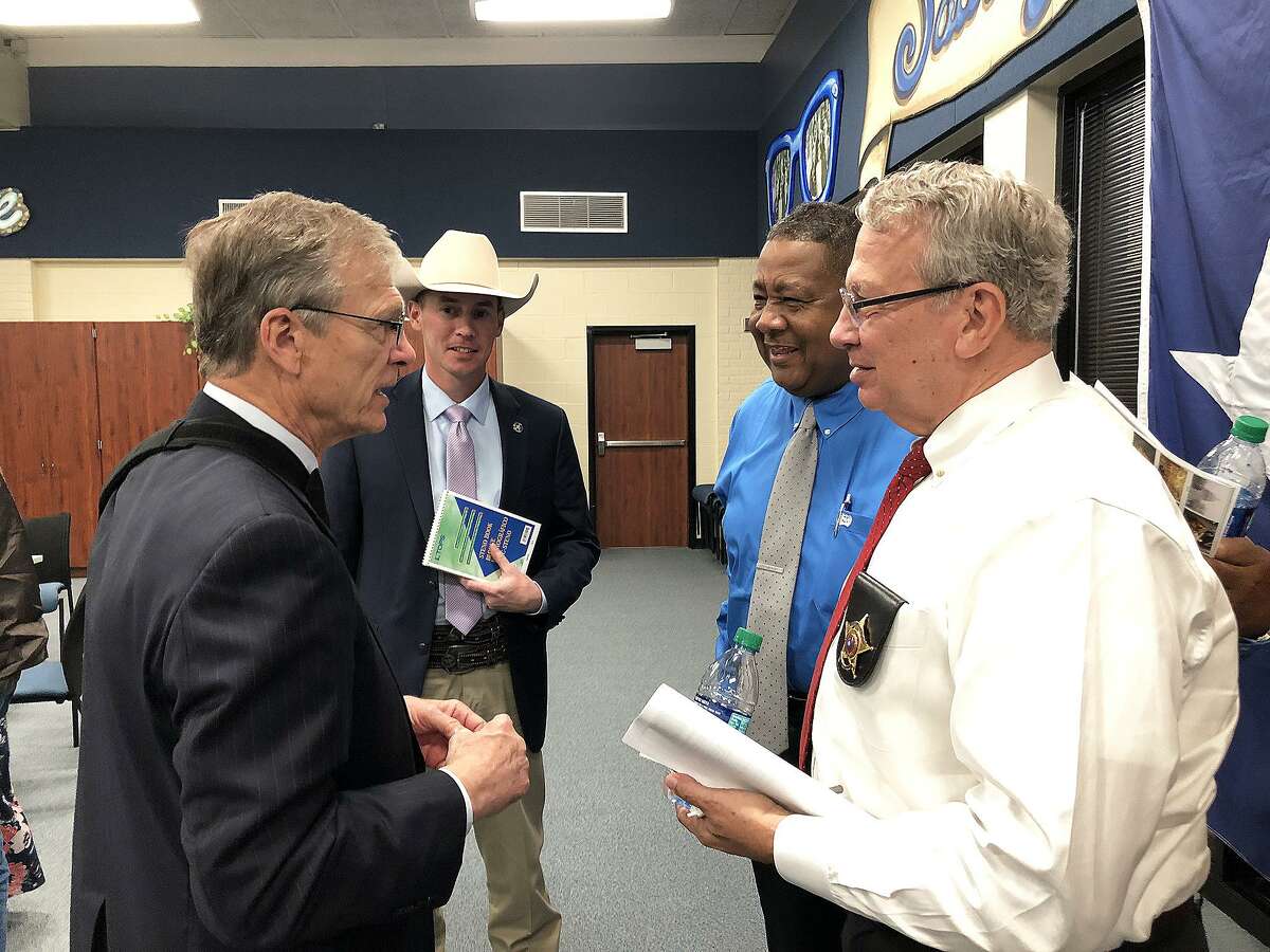 Texas Ranger Chris Cash, Cleveland Police Chief Darrell Broussard, and Liberty County Sheriff Bobby Rader talk over the TAPS Act with Congressman Brian Babin.