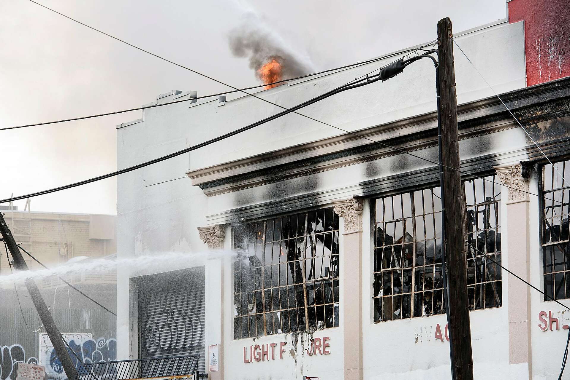 20 evacuated from massive warehouse fire in East Oakland