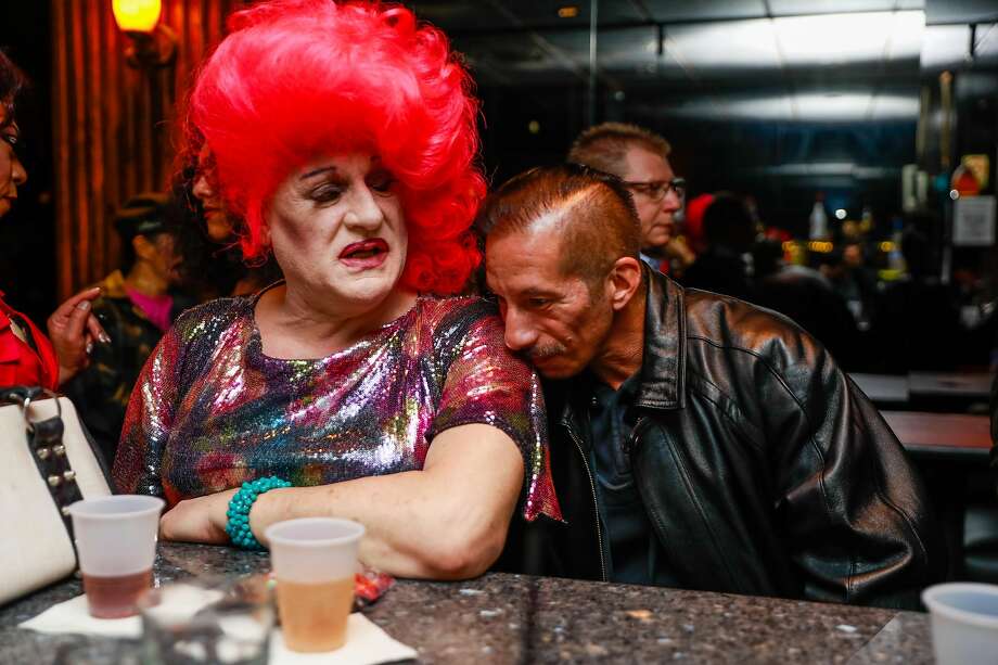 Joseph Castenada rests his head on Collette Le Grand (left) at Divas bar in San Francisco, California, on Saturday, March 30, 2019. Divas, the Tenderloin's three story bar devoted to transgender women celebrated it's final night on Saturday. Photo: Gabrielle Lurie / The Chronicle