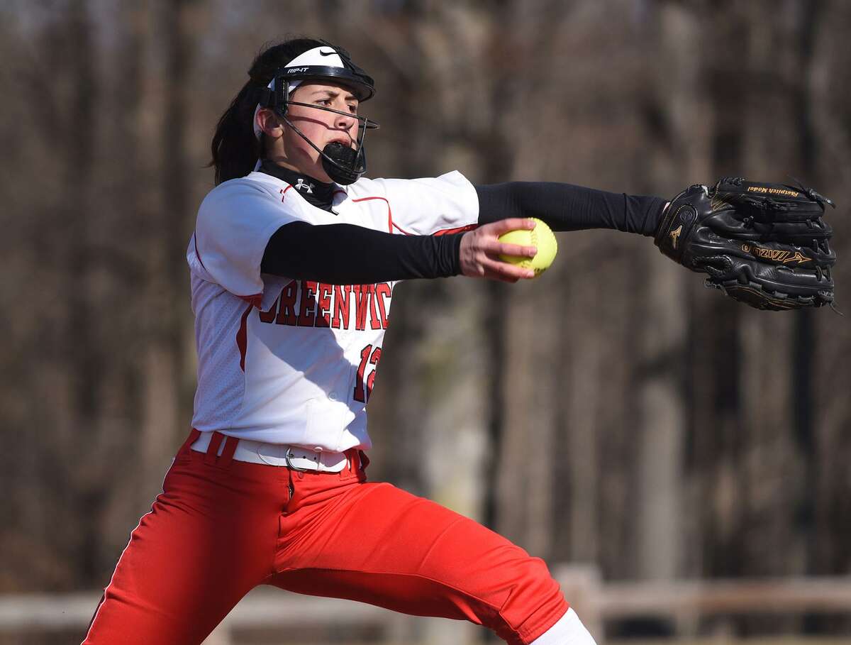 Greenwich senior Sophia Prieto goes into her windup during a softball game against the New Canaan Rams in Waveny Park on Monday.