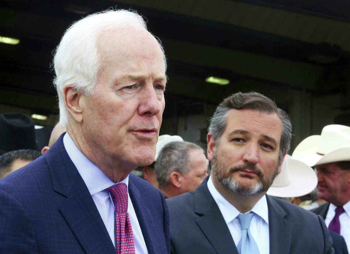 Sen. John Cornyn, left, R-Texas, and Sen. Ted Cruz, R-Texas, pose for pictures after a renaming ceremony at the Javier Vega Jr. Border Patrol Checkpoint on Wednesday, March 20, 2019, near Sarita, Texas. (Joel Martinez/The Monitor via AP)
