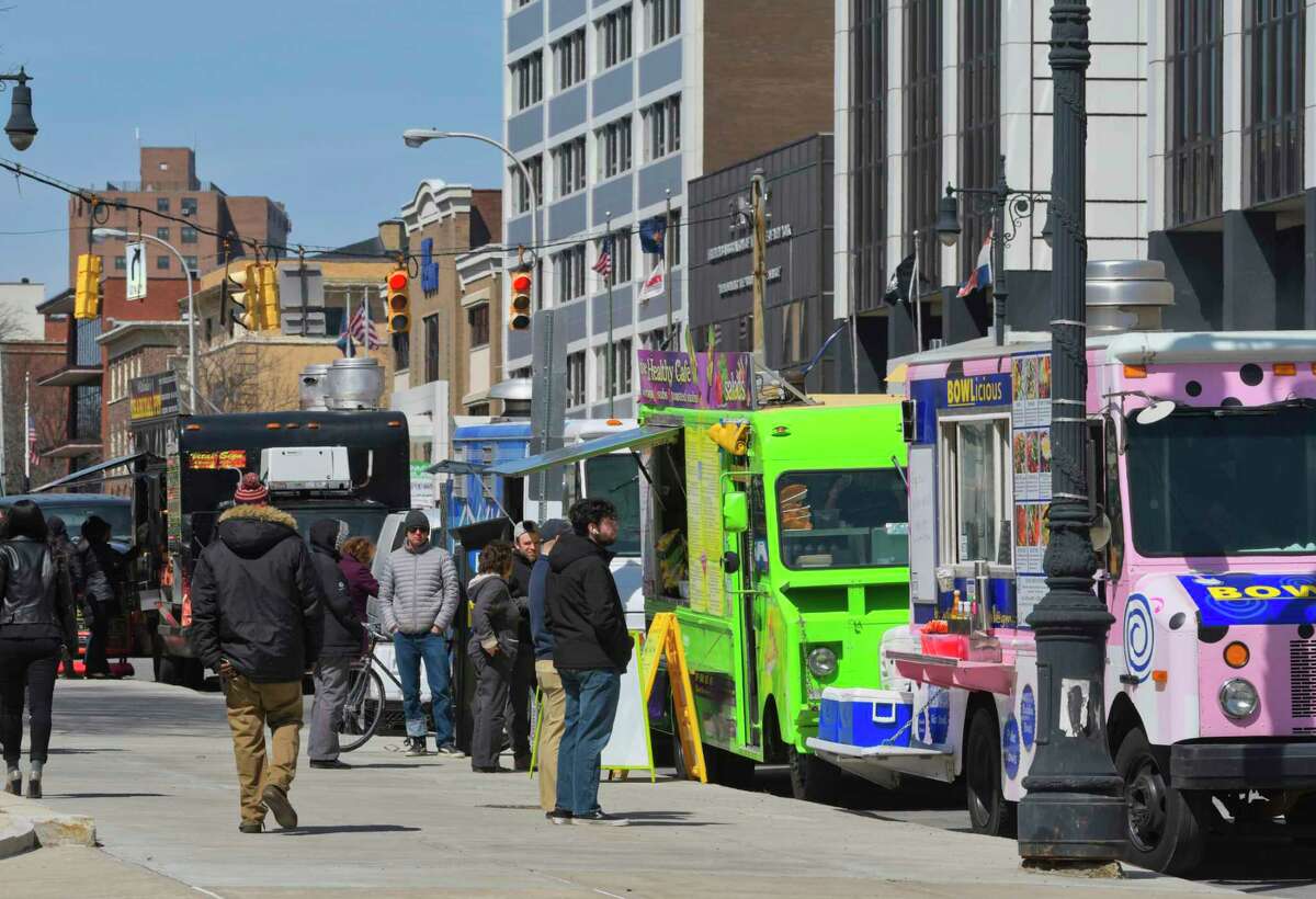 Spring has officially begun. The food trucks are back! People come out to buy lunch from various food vendors along Washington Ave. on Tuesday, April 2, 2019, in Albany, N.Y. (Paul Buckowski/Times Union)