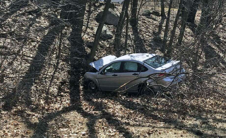 Car crashed in the woods off Route 8 in Shelton The Middletown Press