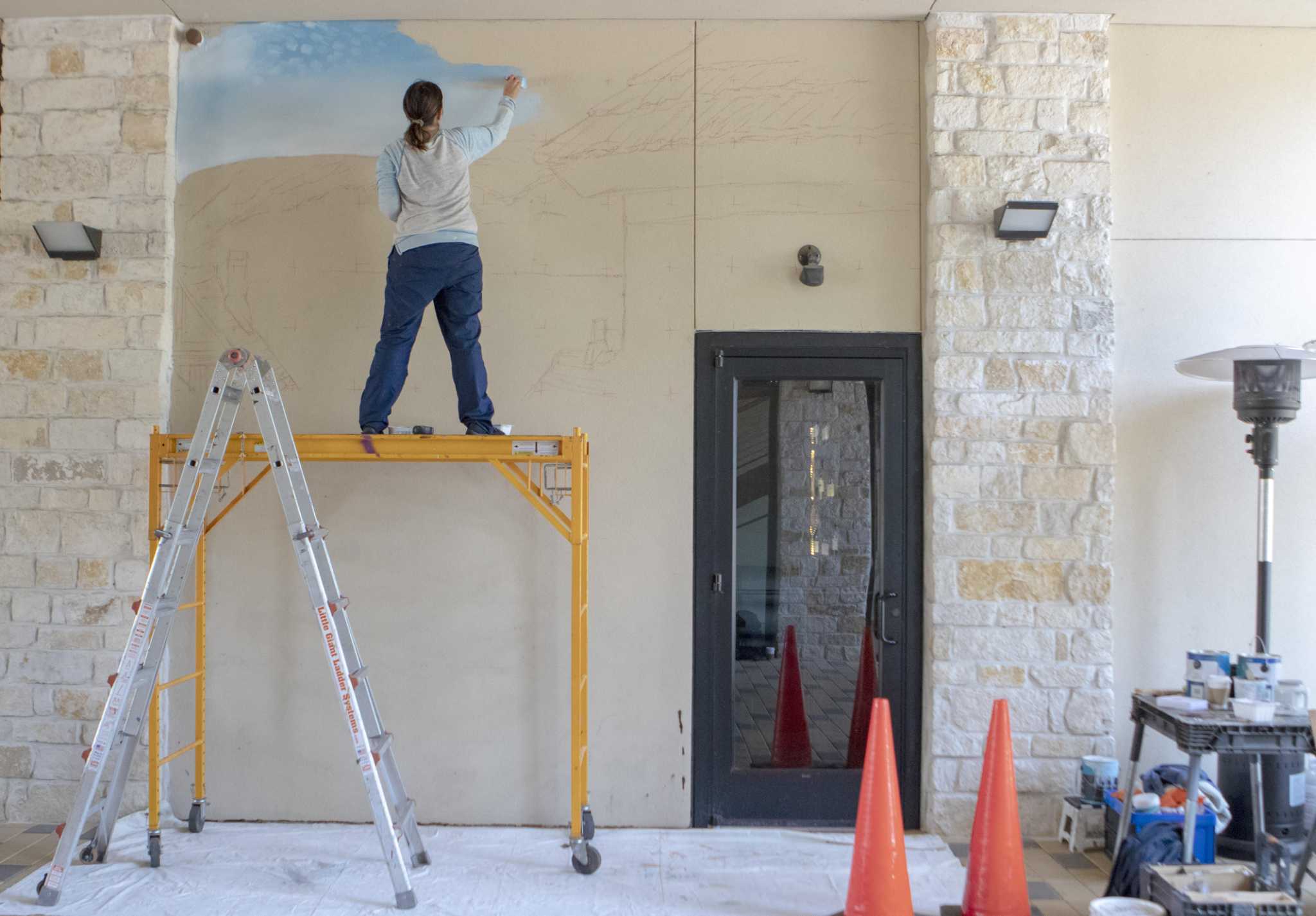 Local Artist Creates Interactive Street Scene Mural In Creekside
