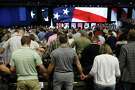 FILE - In this June 12, 2018, file photo, people pray for America at the 2018 Annual Meeting of the Southern Baptist Convention at the Kay Bailey Hutchison Dallas Convention Center in Dallas. The SBC confronted a sex-abuse crisis in the form of an investigation by the Houston Chronicle and San Antonio Express-News. The newspapers reported that hundreds of Southern Baptist clergy and staff had been accused of sexual misconduct over the past 20 years. (Vernon Bryant/The Dallas Morning News via AP, File)