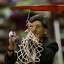 Seattle Pacific University coach Jeff Hironaka cuts down the net after his team beat Western Washington University at Royal Brougham Pavilion in Seattle to move on to the NCAA elite 8 on Monday March 13, 2006.  Joshua Trujillo / Seattle Post-Intelligencer