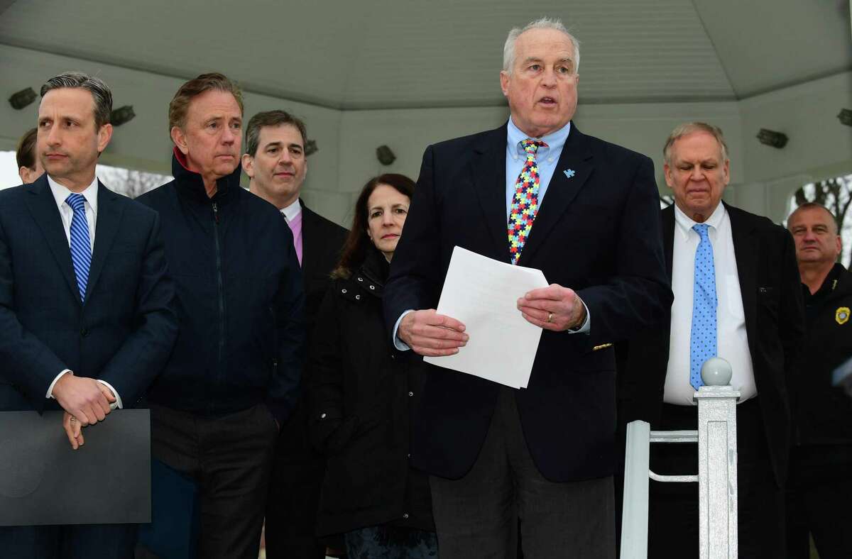 In honor of Autism Awareness Month, Jeff Spahr, Governor Ned Lamont, and State Senator Bob Duff and Families for Autism Awareness gather at the gazebo on the Town Green for Autism Awareness Tuesday, April 2, 2019, in Norwalk, Conn. Sparh chairs the upstart Norwalk Special Education Parent Advisory Council.