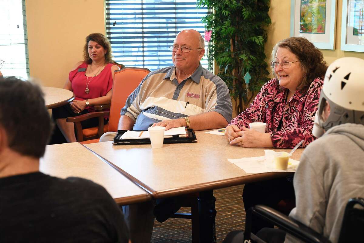 Background from left, Stephanie Roberts, Jeff Bell and Patricia Coppage lead a grief counseling group at the Bonne Vie nursing facility on Tuesday. The event is a partnership between Hospice and Claybar Funeral Home. Photo taken Tuesday, 3/26/19