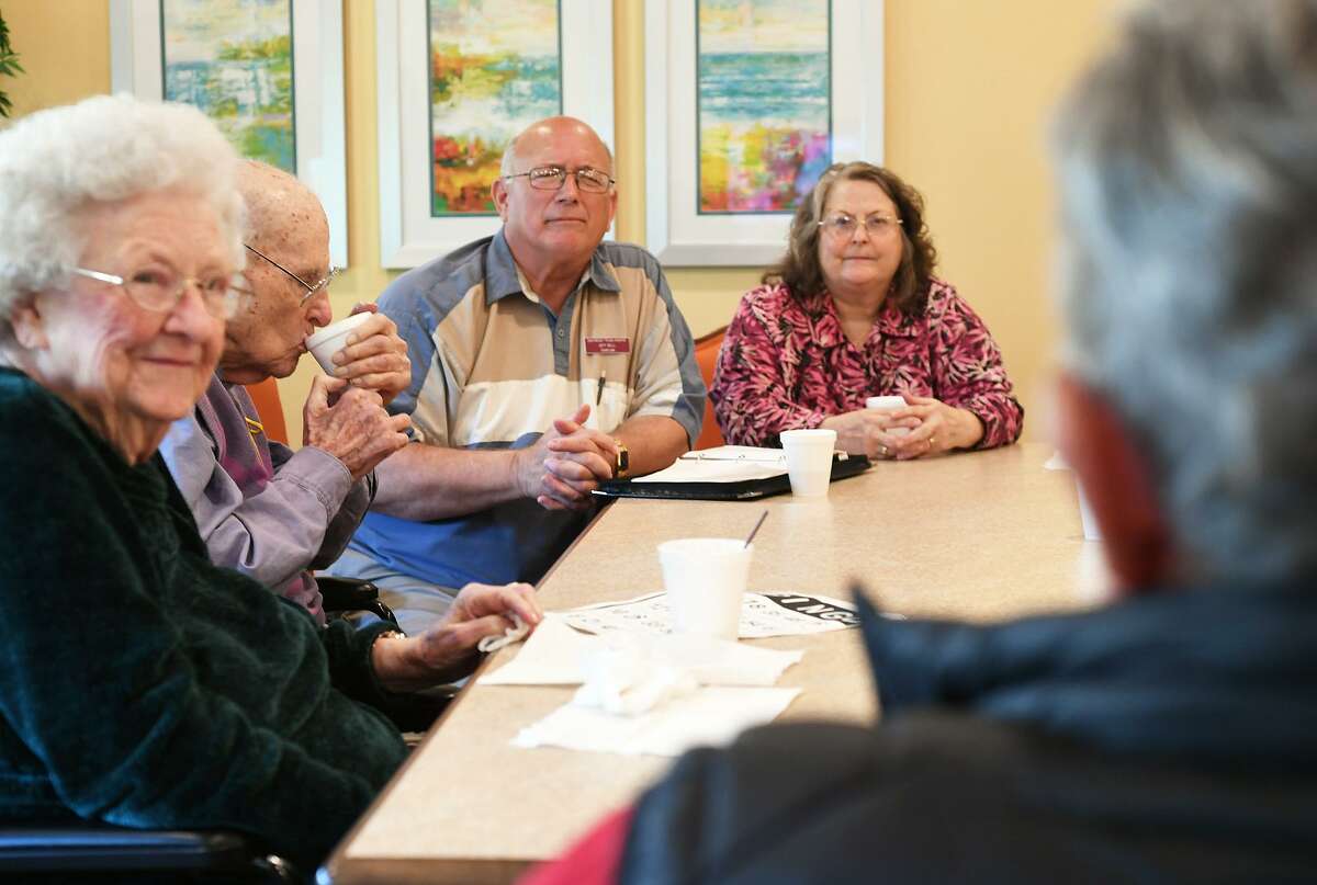 Melivn Sengwen, right, talks to a group about living after his wife's death during a grief counseling event at the Bonne Vie nursing facility on Tuesday. The event is a partnership between Hospice and Claybar Funeral Home. Photo taken Tuesday, 3/26/19